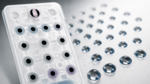 Conductive carbon pills and metal domes as electrical contacts for actuation of silicone keypads