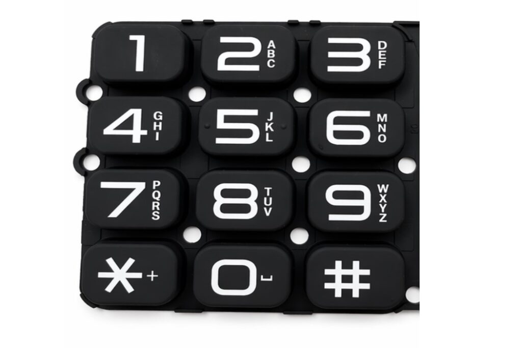 A silicone keypad with matte PU coating and position holes for telephones
