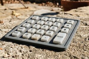 A waterproof and dustproof silicone keypad under exposure to dirt, dust, and UV light from sunlight