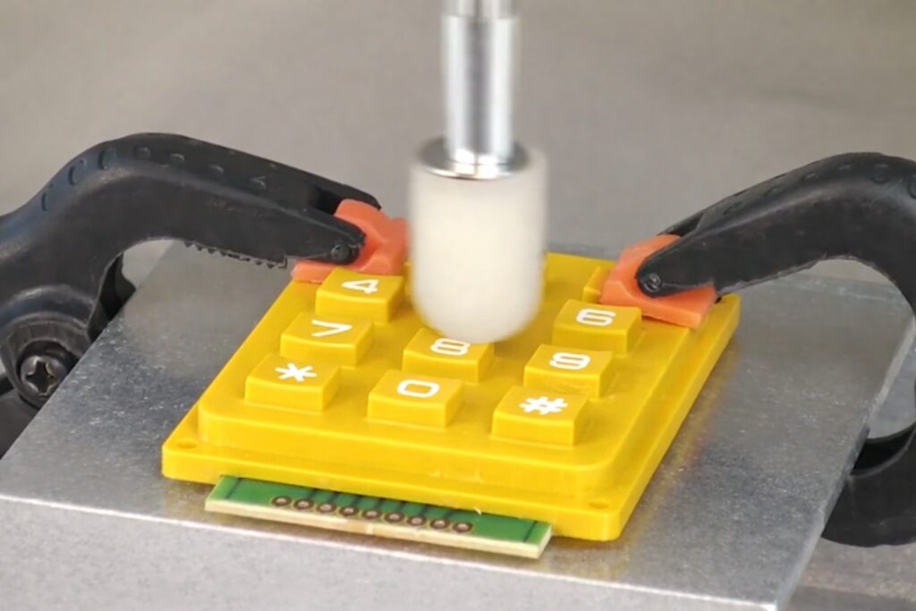 Testing for a yellow silicone keypad with an automatic finger tester