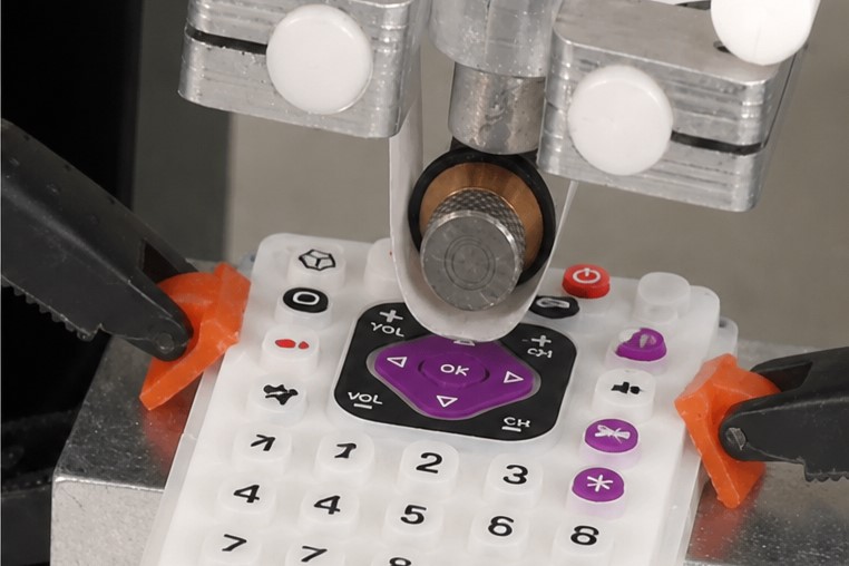 A coloried silicone keypad for TV remote controller is tested by RCA abrasion tester