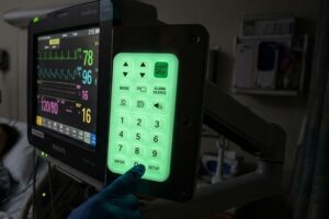 Glow-in-the-dark silicone rubber keypad in medical instrument application in patient ward