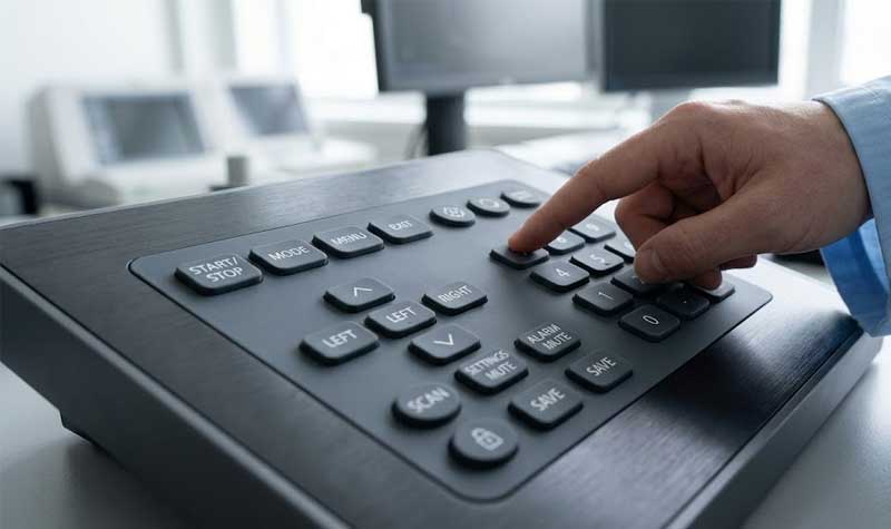 high end silicone keypad with custom legends and a clear anti microbial matte coating set within a professional medical equipment control panel