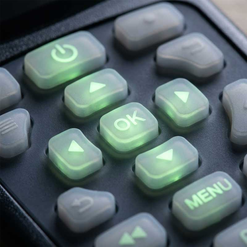 silicone keypad featuring translucent keys with integrated molded icons that glow with a soft green LED backlight