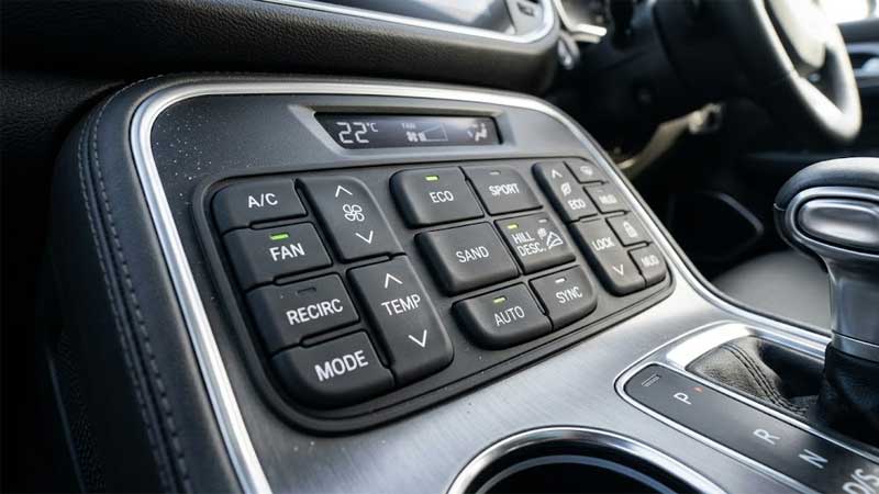 A realistic automotive control panel featuring silicone keypad buttons