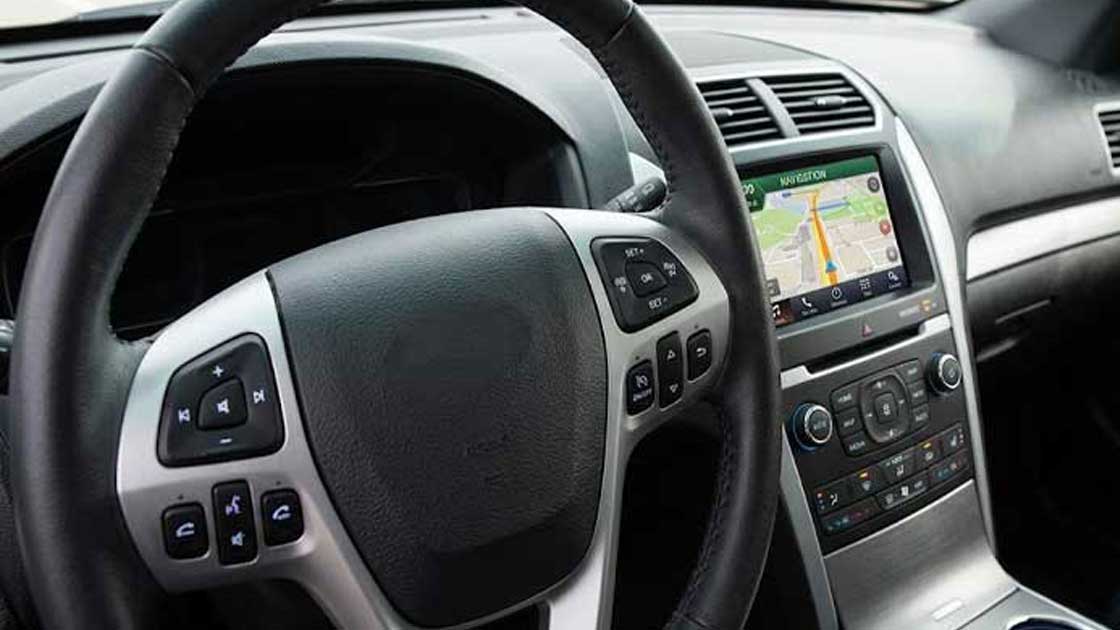 Tactile silicone keypads integrated into a car steering wheel and dashboard control panel for automotive electronics 1